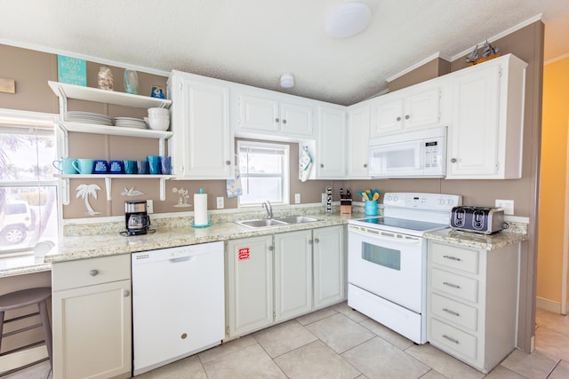 kitchen featuring white cabinetry, white appliances, sink, and light stone counters