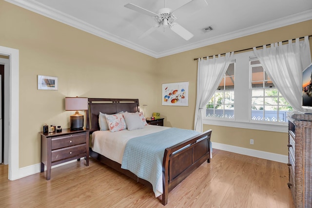 bedroom with crown molding, visible vents, baseboards, and light wood-type flooring