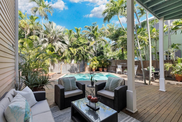 deck featuring a fenced backyard and an outdoor living space