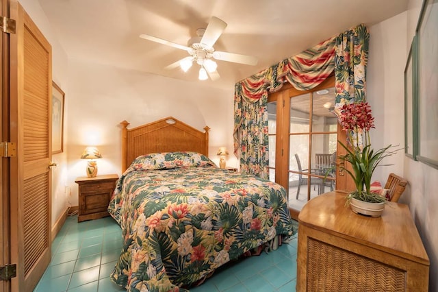 bedroom featuring ceiling fan, tile patterned floors, and access to outside