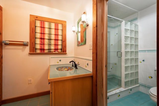 bathroom featuring vanity, an enclosed shower, tile patterned floors, and toilet