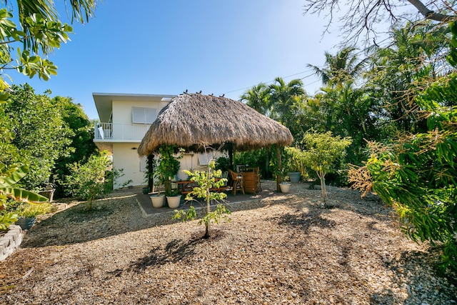 view of yard with a gazebo, a balcony, and a patio