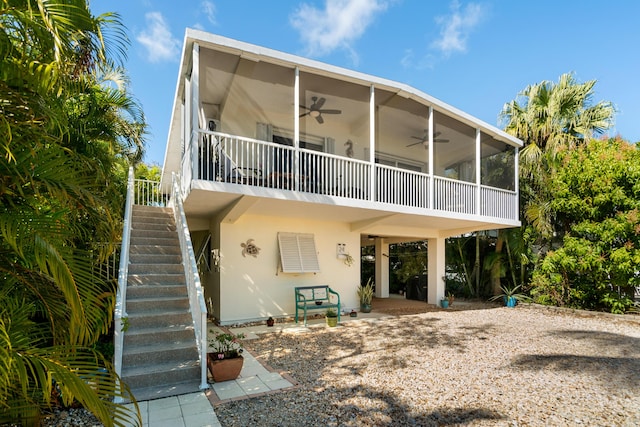 back of house featuring ceiling fan and a patio area