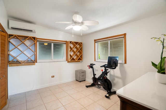 exercise area featuring a wall mounted air conditioner, ceiling fan, and light tile patterned floors