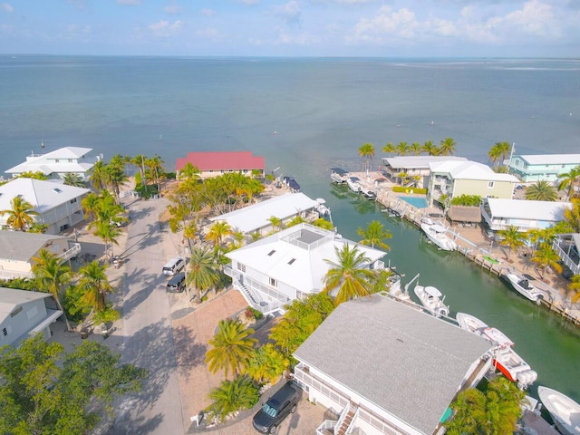 bird's eye view featuring a water view and a residential view