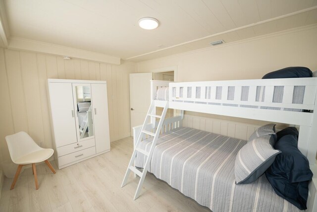 218 Bristol Ct, Tavernier, FL 33070 - bedroom featuring light wood-type flooring and ornamental molding
