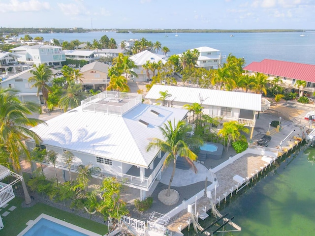 aerial view featuring a residential view and a water view