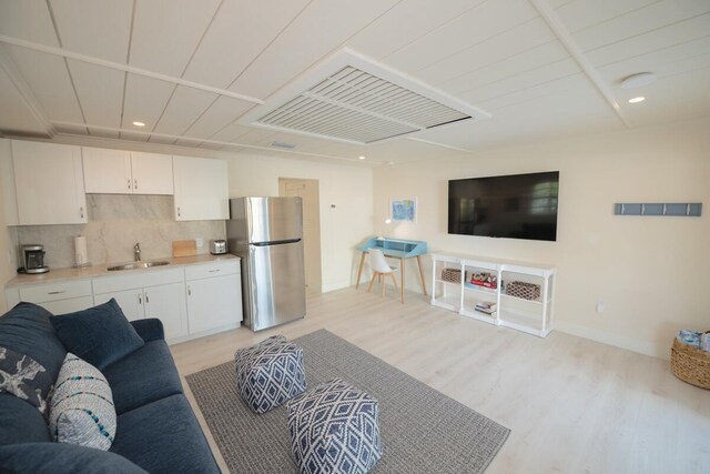 218 Bristol Ct, Tavernier, FL 33070 - living room featuring light wood-style flooring, baseboards, and recessed lighting