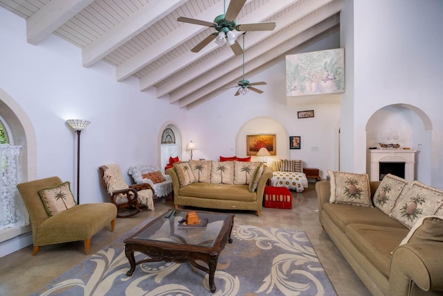 living room featuring beamed ceiling, ceiling fan, and high vaulted ceiling