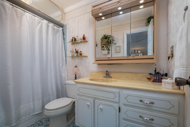 bathroom with vanity, ornamental molding, and toilet