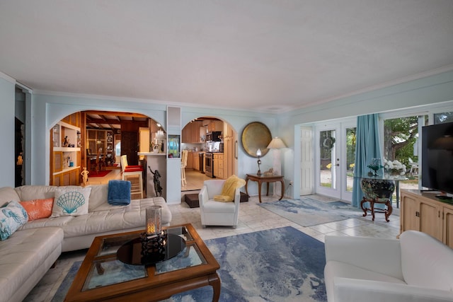 living room featuring crown molding and french doors