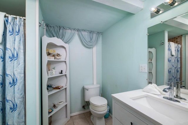 bathroom featuring tile patterned flooring, vanity, and toilet