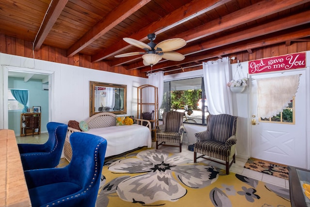 bedroom with wood ceiling, tile patterned floors, beamed ceiling, and wood walls