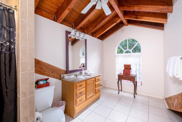 bathroom with lofted ceiling with beams, vanity, ceiling fan, toilet, and tile patterned floors