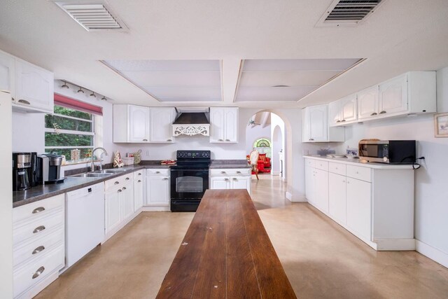 kitchen with white cabinetry, sink, white dishwasher, black range with electric cooktop, and wall chimney range hood