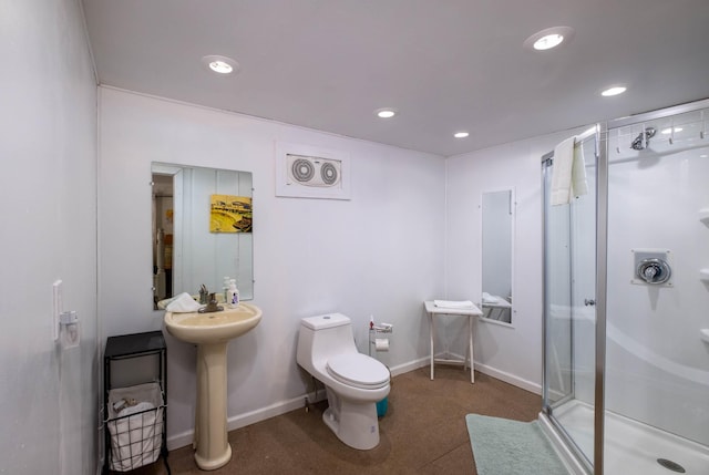 bathroom with toilet, an enclosed shower, and sink