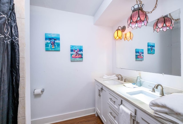 bathroom featuring vanity and wood-type flooring