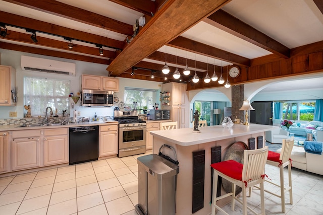 kitchen featuring pendant lighting, a wall mounted air conditioner, beamed ceiling, sink, and black appliances