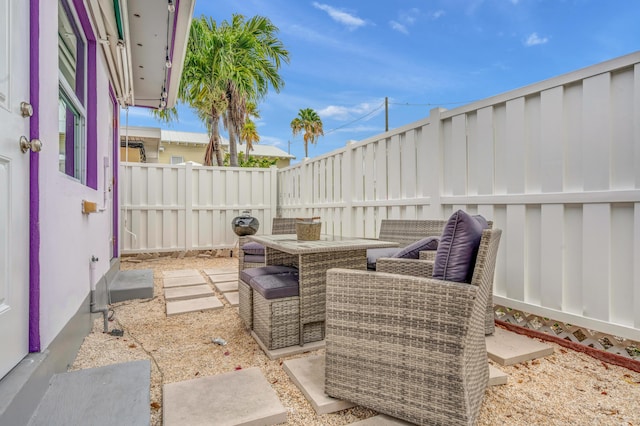 view of patio featuring outdoor dining area and a fenced backyard