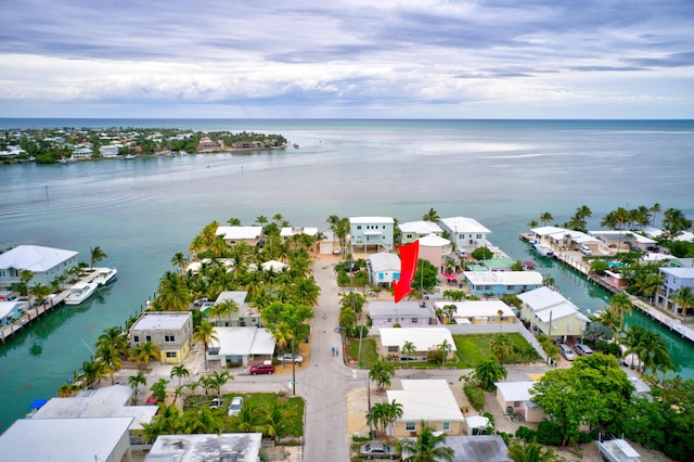 birds eye view of property featuring a water view and a residential view