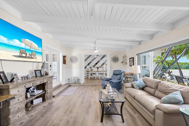 living room featuring ceiling fan, beam ceiling, light hardwood / wood-style floors, and wooden ceiling