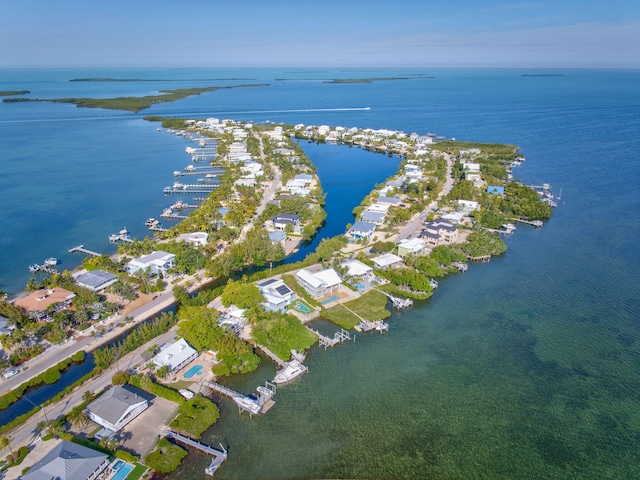 birds eye view of property with a water view and a residential view