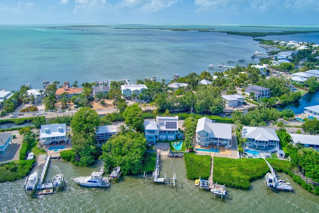 drone / aerial view featuring a water view and a residential view