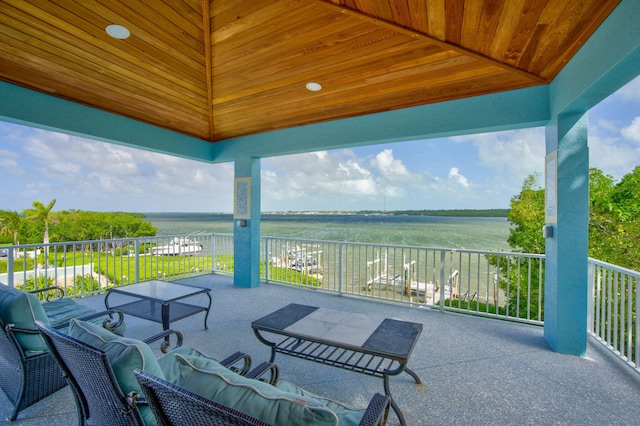 view of patio / terrace with a rural view and a balcony