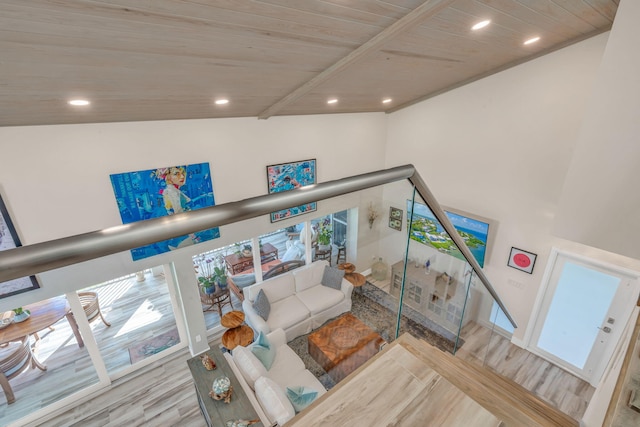 living room featuring lofted ceiling, wood ceiling, and light hardwood / wood-style floors