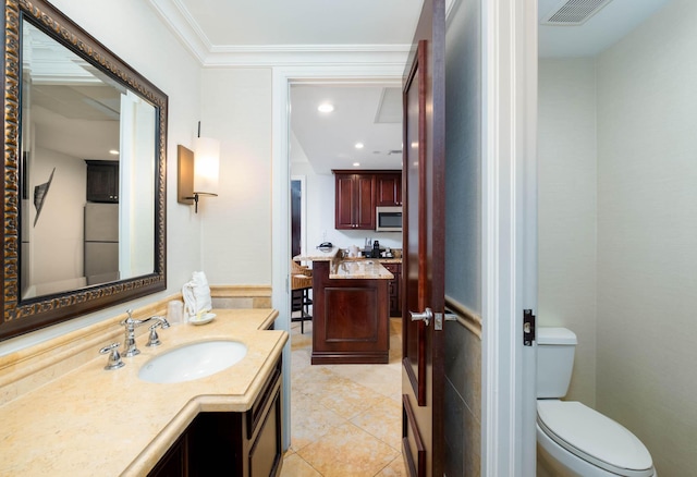 81801 Overseas Hwy Unit 754, Islamorada, FL 33036 - bathroom featuring vanity, toilet, tile patterned flooring, and crown molding