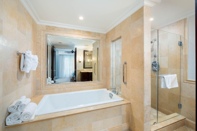 81801 Overseas Hwy Unit 754, Islamorada, FL 33036 - ensuite bathroom featuring ornamental molding, a shower stall, a garden tub, tile walls, and vanity