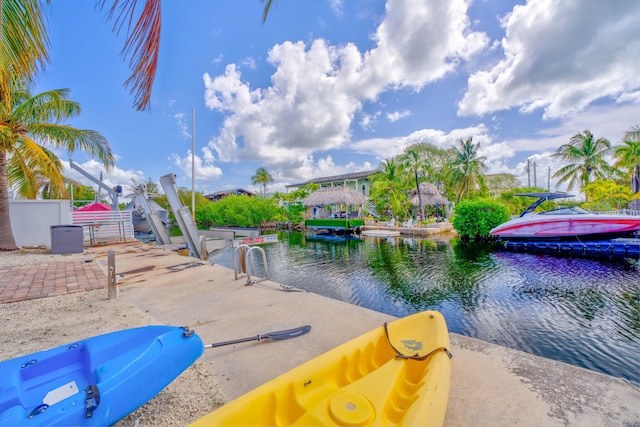 dock area featuring a water view and boat lift