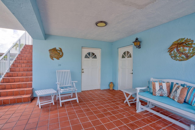 doorway to property featuring stucco siding