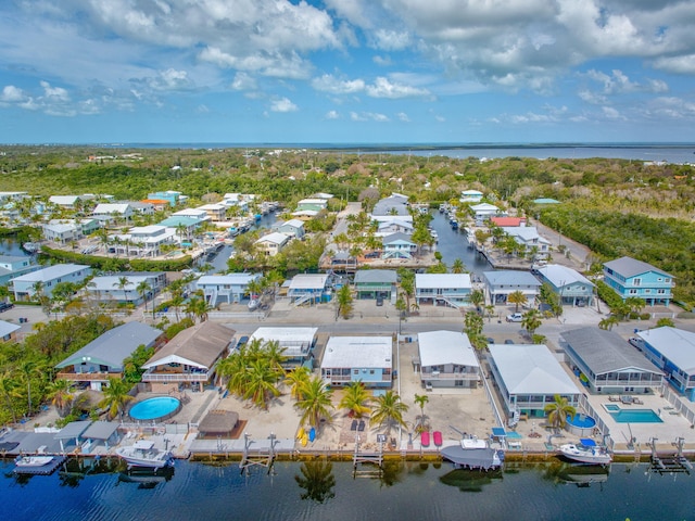 birds eye view of property featuring a water view and a residential view