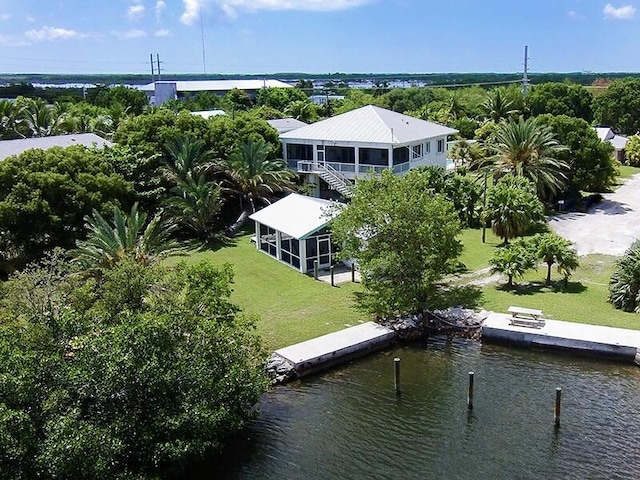 birds eye view of property featuring a water view