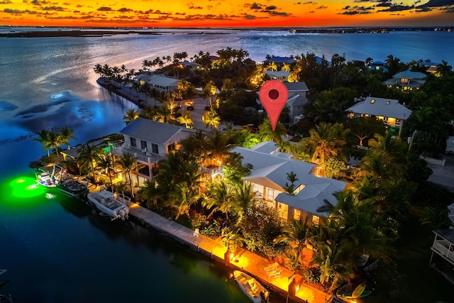 aerial view at dusk with a water view