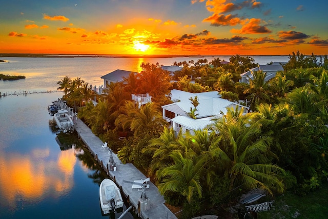 aerial view at dusk with a water view