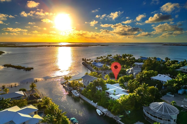 aerial view at dusk with a water view