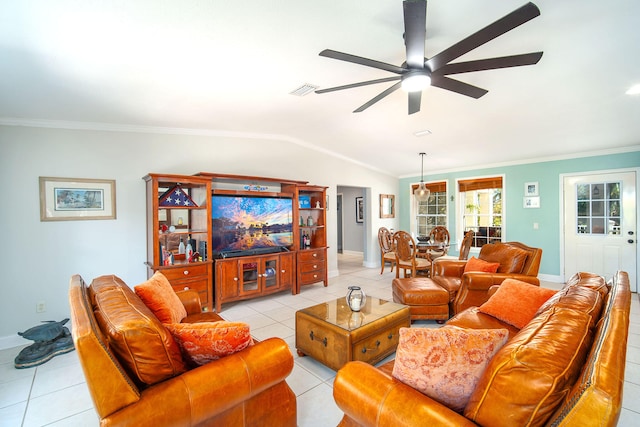 living room with crown molding, ceiling fan, lofted ceiling, and light tile patterned flooring