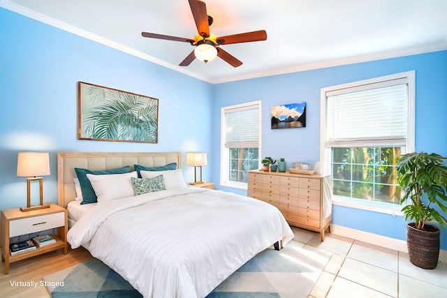 bedroom featuring ornamental molding, ceiling fan, and light tile patterned flooring