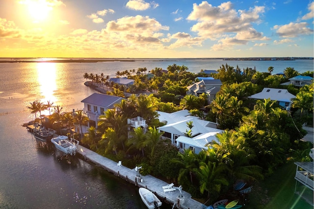 aerial view at dusk with a water view