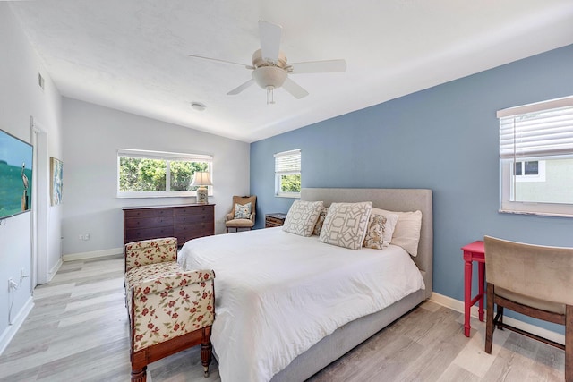 bedroom with ceiling fan and light wood-type flooring