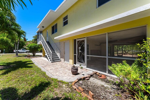 rear view of property with a yard