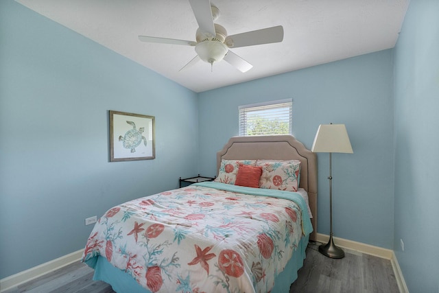 bedroom featuring wood-type flooring and ceiling fan