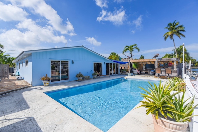 view of swimming pool with a patio