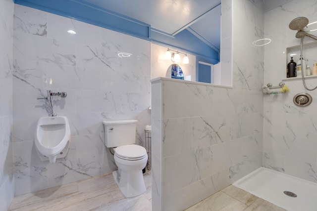 bathroom with a bidet, lofted ceiling, toilet, and a tile shower