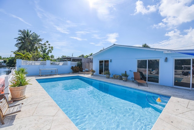 view of swimming pool featuring a patio area