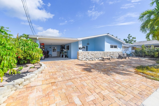 view of front facade with a carport