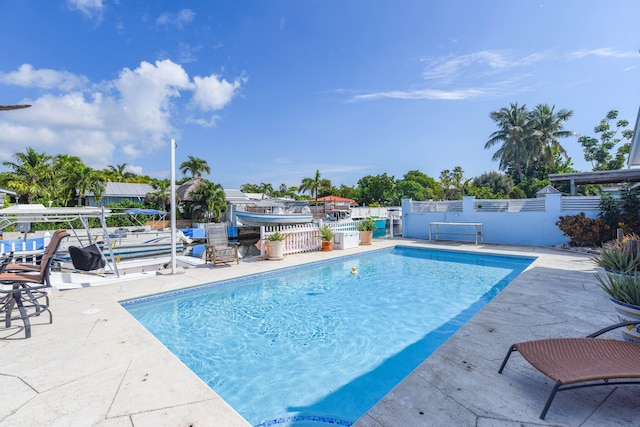 view of swimming pool featuring a patio