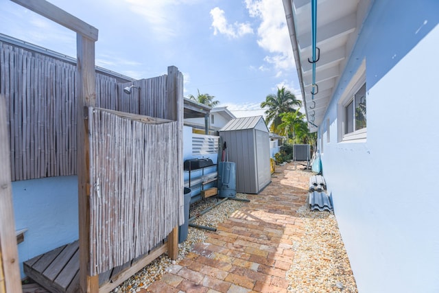 view of patio featuring a shed